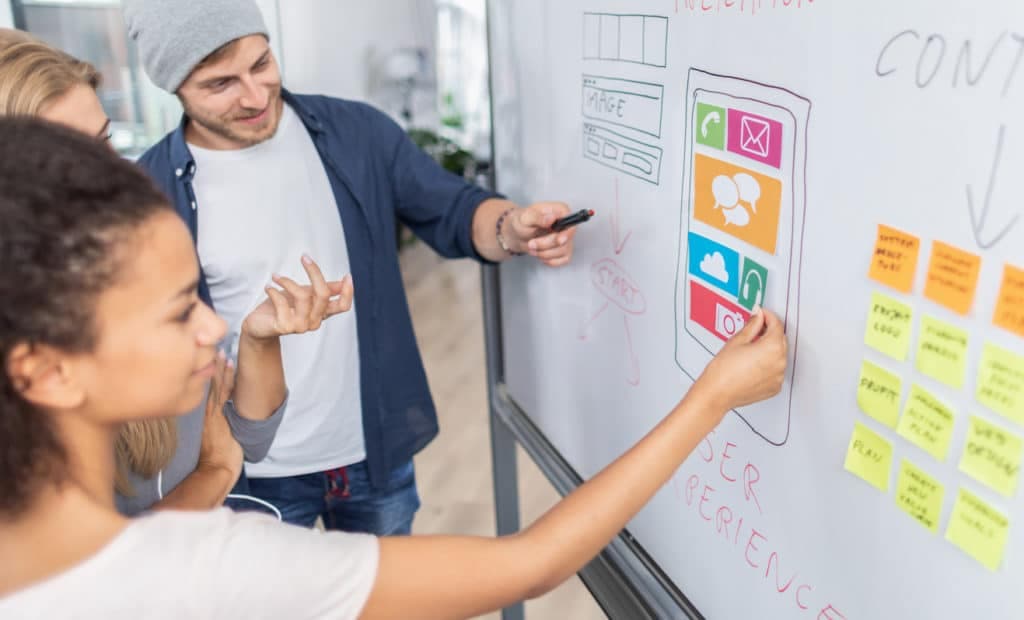 Designers drawing website ux app development. User experience concept.